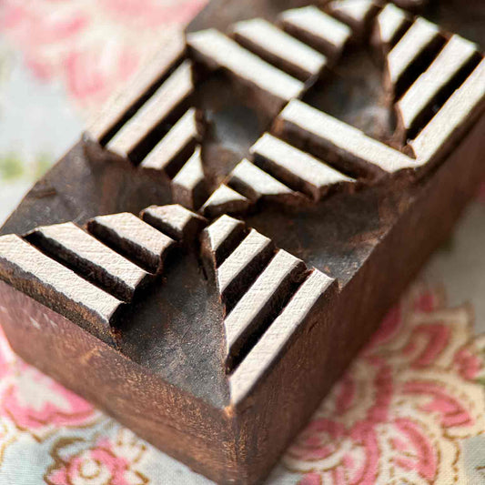 Close-up Windmill Border Indian Wood Block Stamp showing striped geometric sections arranged in a repeating rotational pattern.