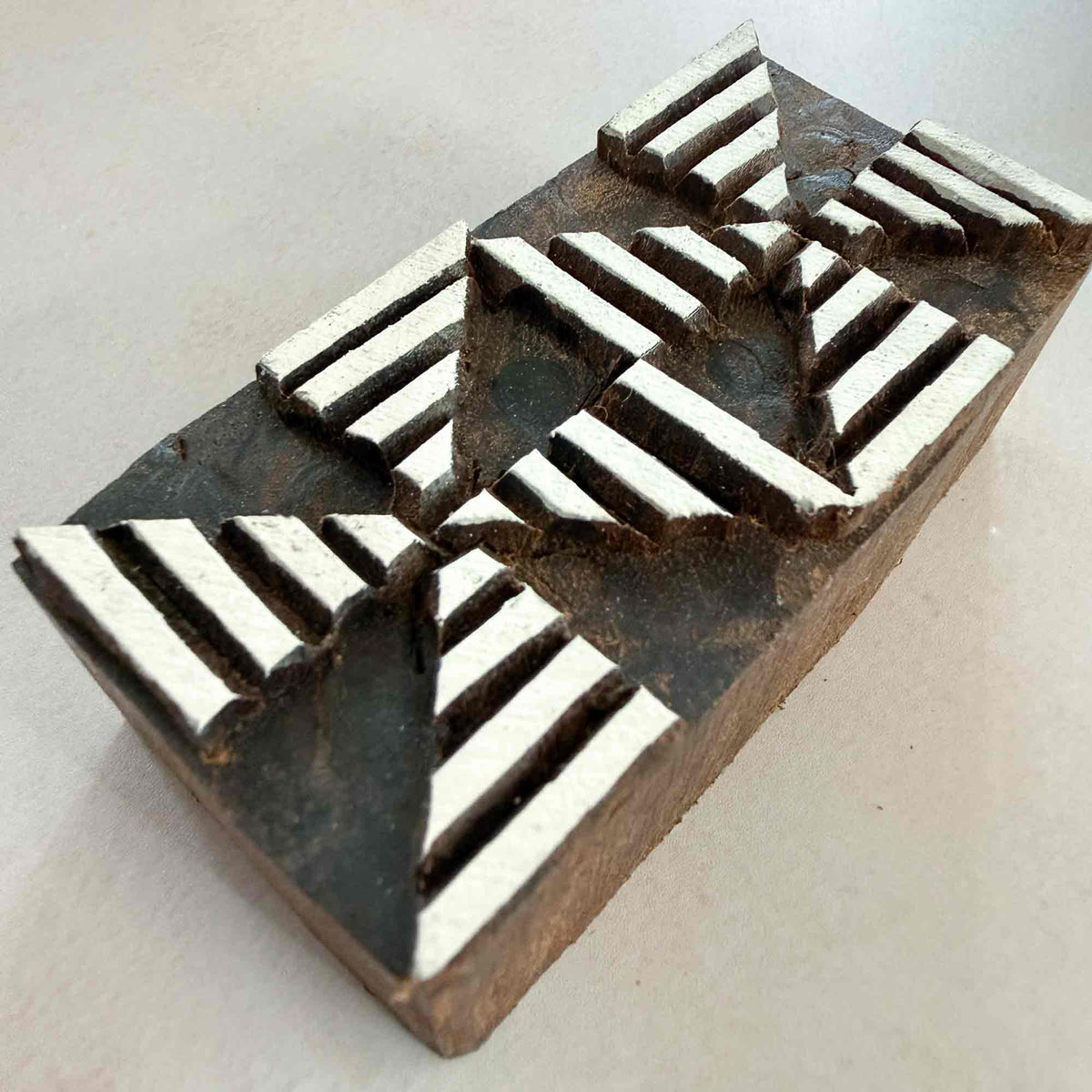 Angled view of Windmill Border Traditional Printing Block showing the raised geometric pattern and hand-carved wooden surface.