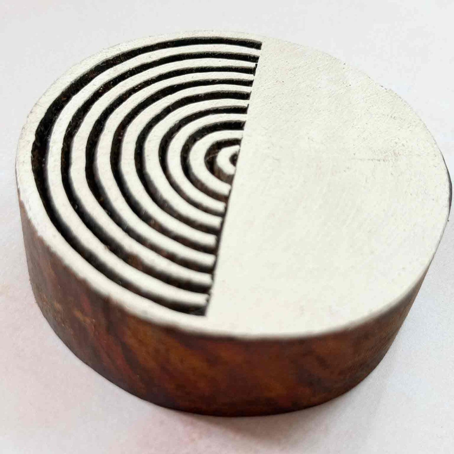 Indian wood block stamp — Yin design viewed from side, showing carved depth and smooth arc texture, hand-carved wooden stamp, premium traditional printing block hardwood