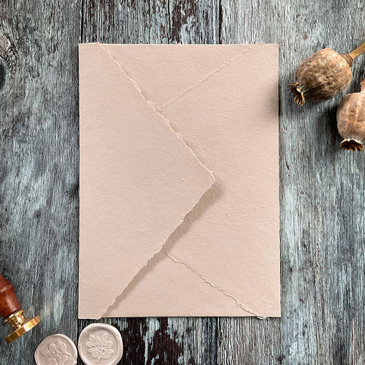 handmade paper envelopes in natural colour.  5 x 7 handmade cotton rag envelopes with deckled edge and diamond flap.  