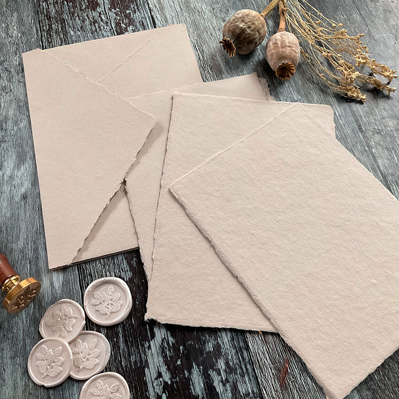 Natural colour handmade recycled paper with a deckle edge.  Beige handmade paper.  Perfect for watercolour painting and calligraphy.  Vegan, Tree Free, Acid Free Paper.  By The Natural Paper Company
