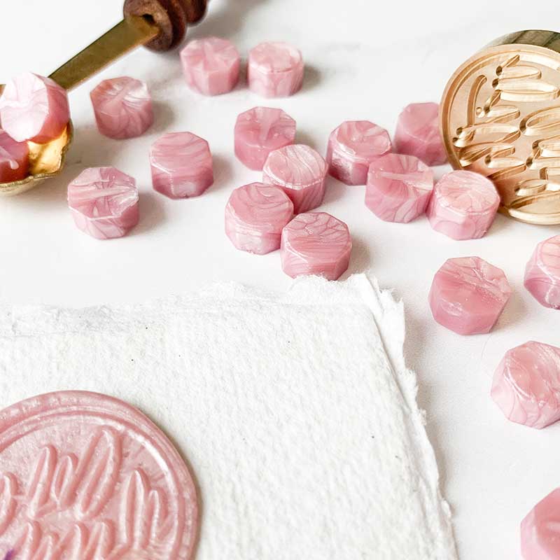 pearlised pink sealing wax beads to make wax stamps and seals.  Wax beads to melt with a melting spoon