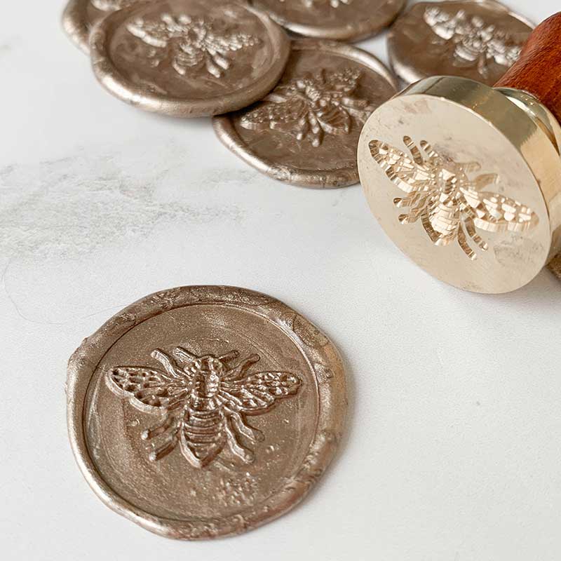 bee design wax stamp.  Champagne Gold wax seal with bee design