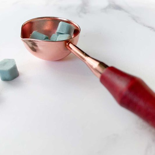 small copper spoon with rose wood handle.  Small spoon for melting sealing wax.  Small spoon with large crucible bowl