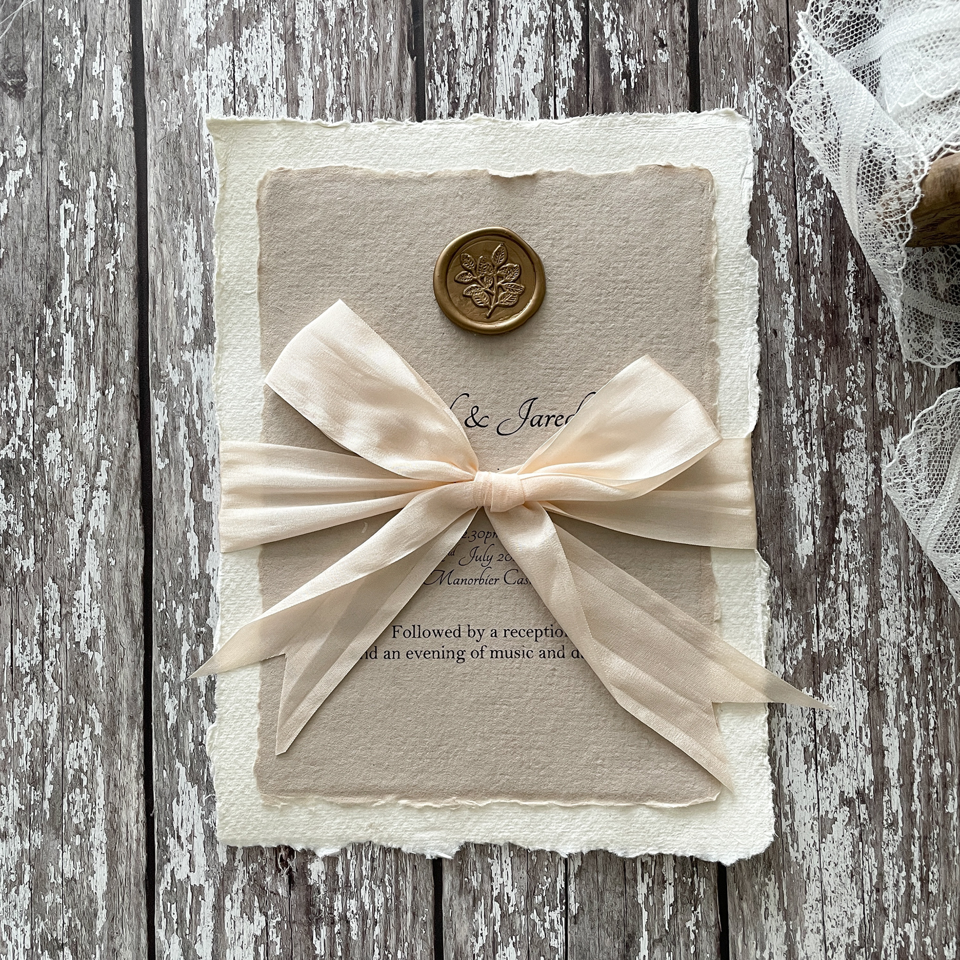 Wedding invitation made using gold wax seal, hand made paper and silk ribbon.  Eco friendly wedding invitation in neutral colours.  Natural wedding invitation