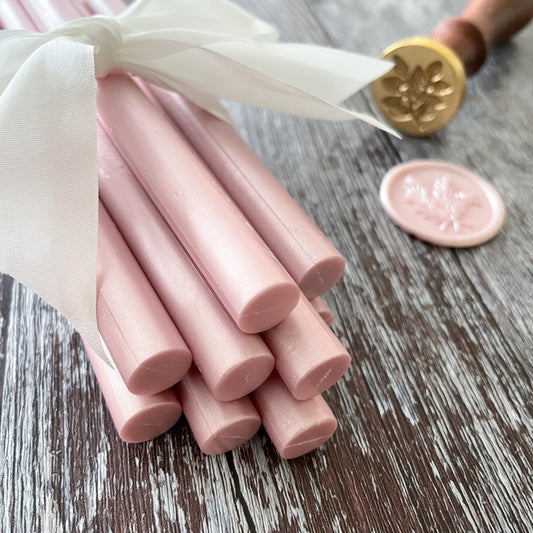 Pearlised pink sealing wax sticks.  Pink wax for making envelope seals and wax stamps.  Wax sticks to use with glue gun or melting spoon