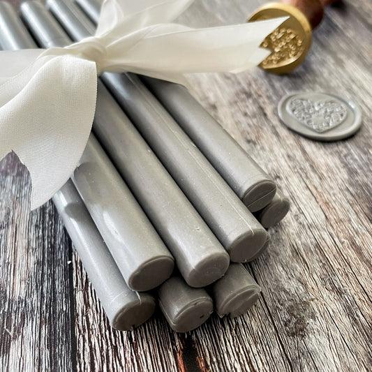 Grey sealing wax sticks.  Sealing wax for making envelope seals and wax stamps.  Graphite grey wax to use with wax gun or melting spoon