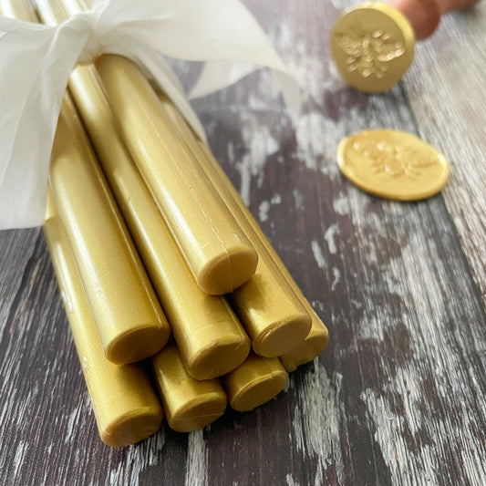Bright gold sealing wax sticks.  Metallic gold wax for making wax stamps and envelope seals.  Plastic free wax.  Eco friendly