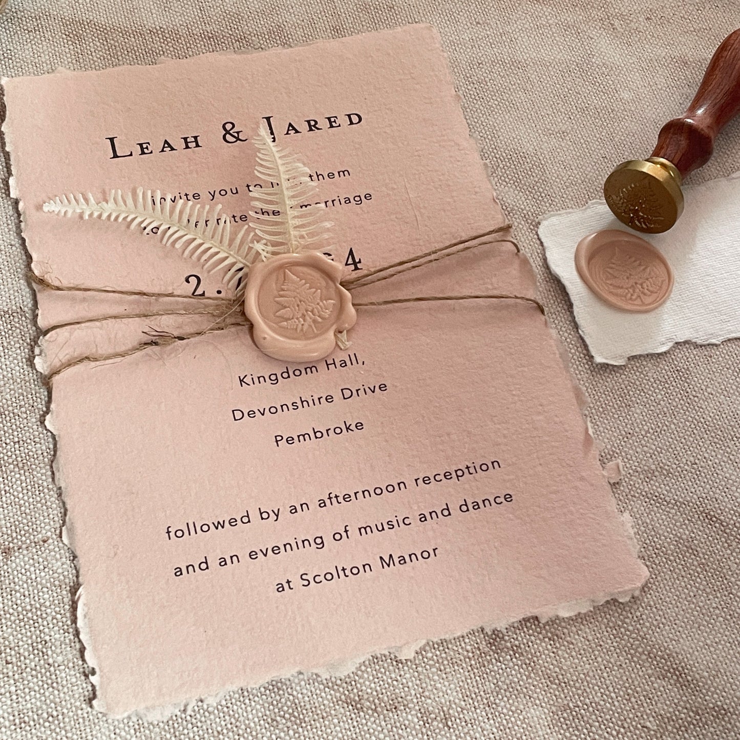Easy DIY wedding invitation made from handmade paper, a fern leaf wax seal and jute string.  Eco friendly wedding invitations.  By The Natural Paper Company