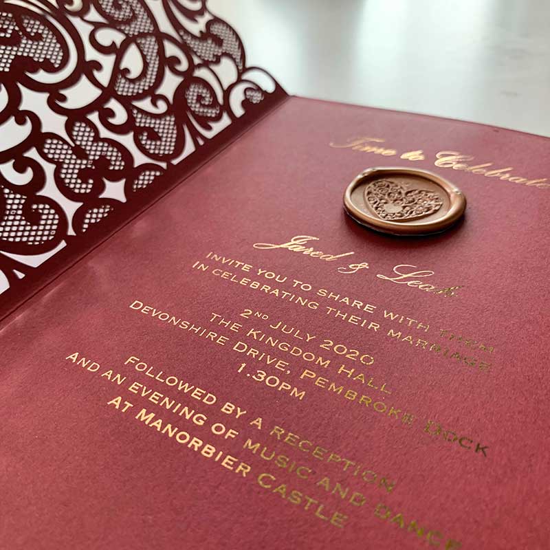 burgundy wedding invitation with copper wax seal.  Hear pattern wax seal in copper. Luxury wedding invitaiton with foiled print