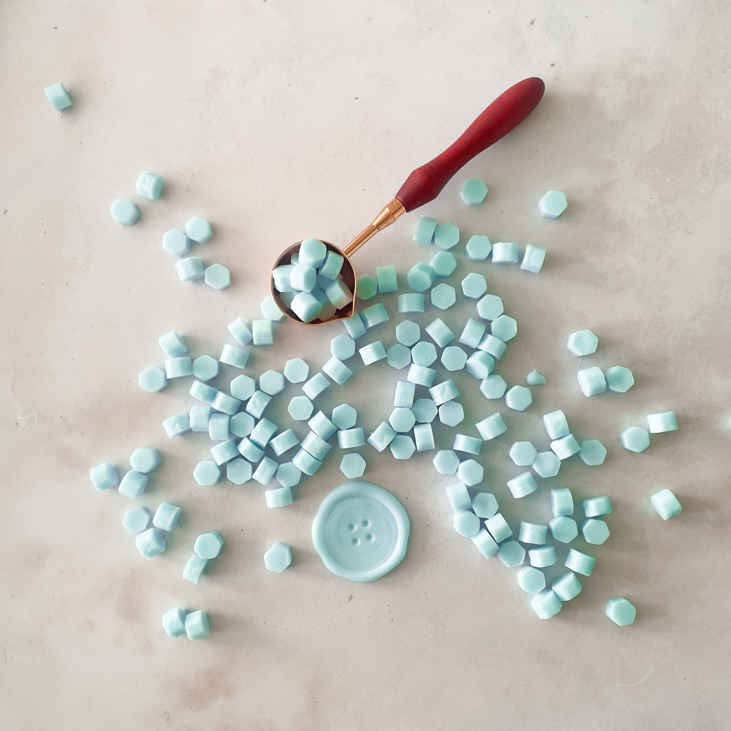 small wax beads for making wax seals.  Aqua blue colour wax to use with a melting spoon and wax stamp