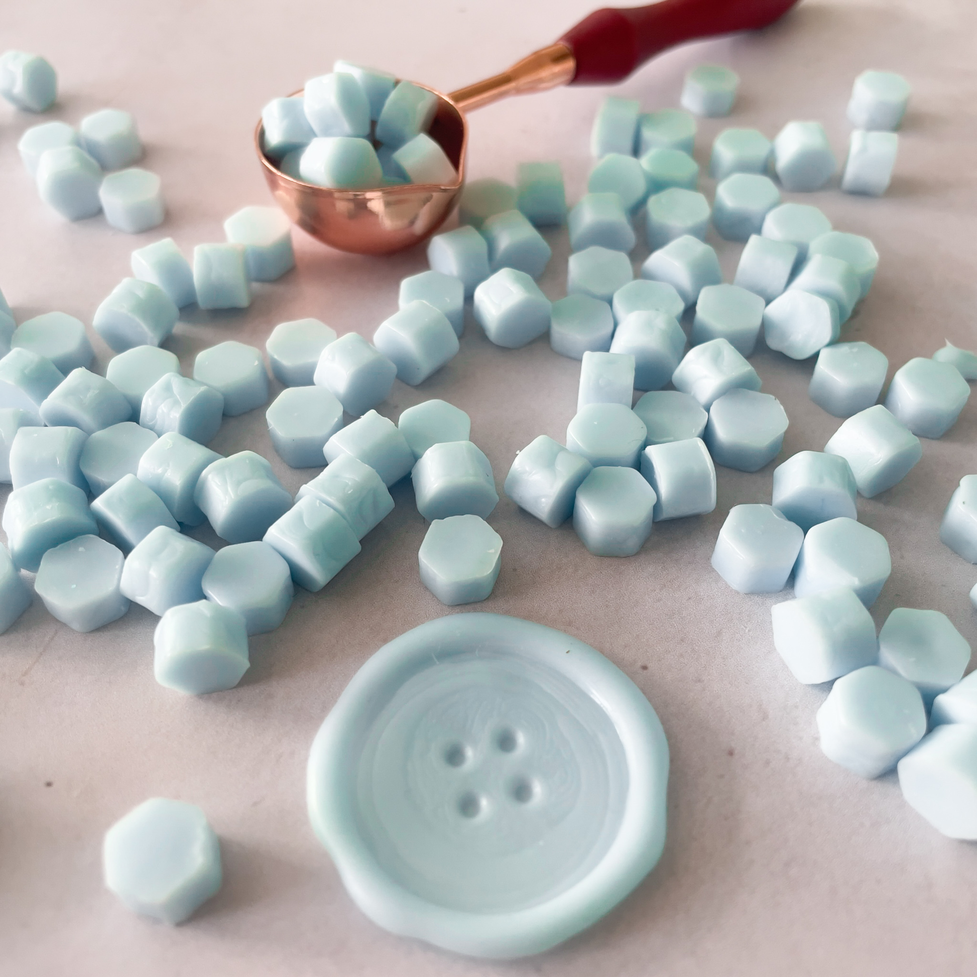 aqua blue sealing wax beads to use with a melting spoon.  Sealing wax supplies
