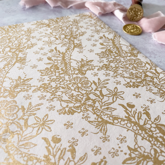blush pink patterned paper with gold floral print.  Decorative recycled paper in light blush pink and gold