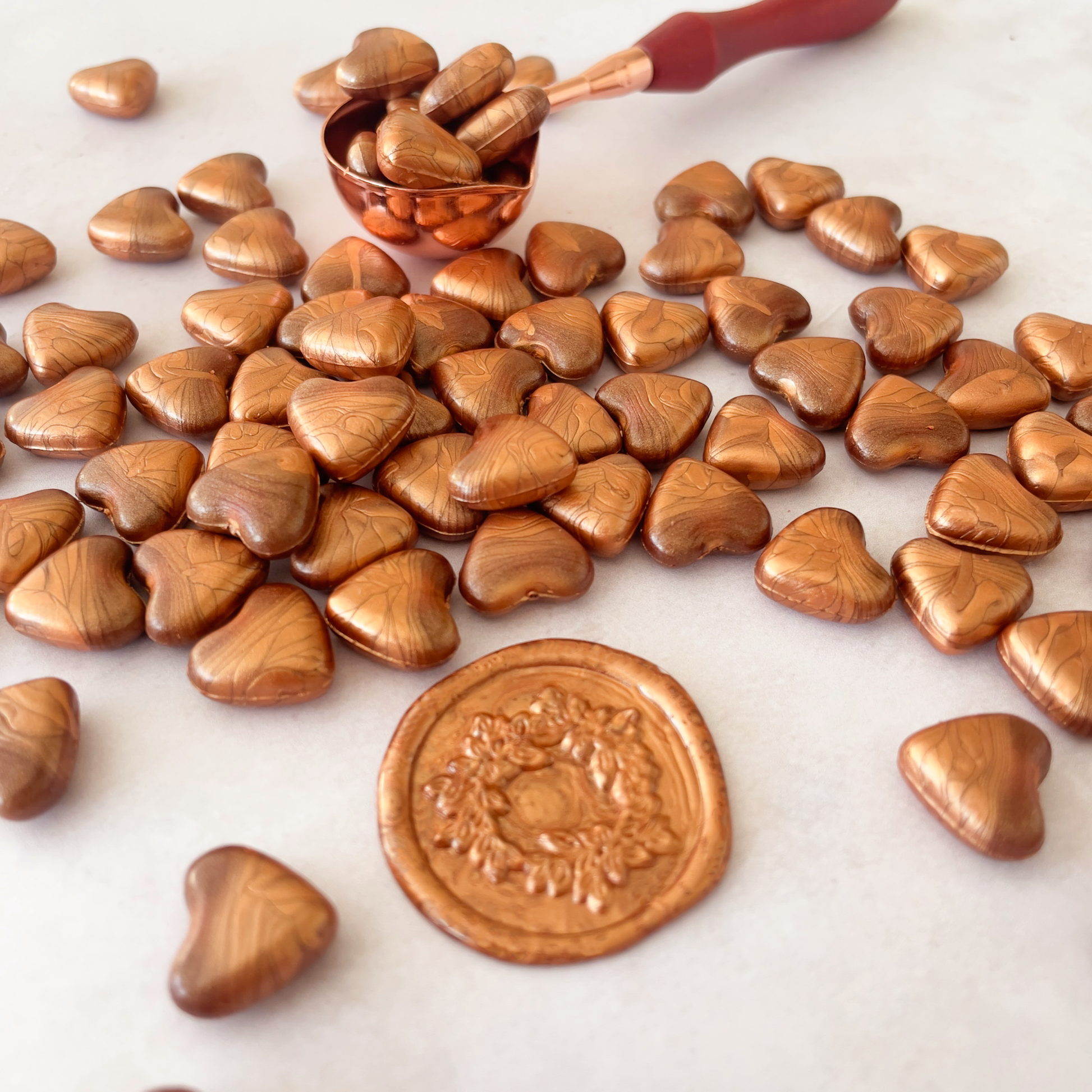 copper wax beads in the shape of a heart.  Sealing wax to make wax stamps and wax seals