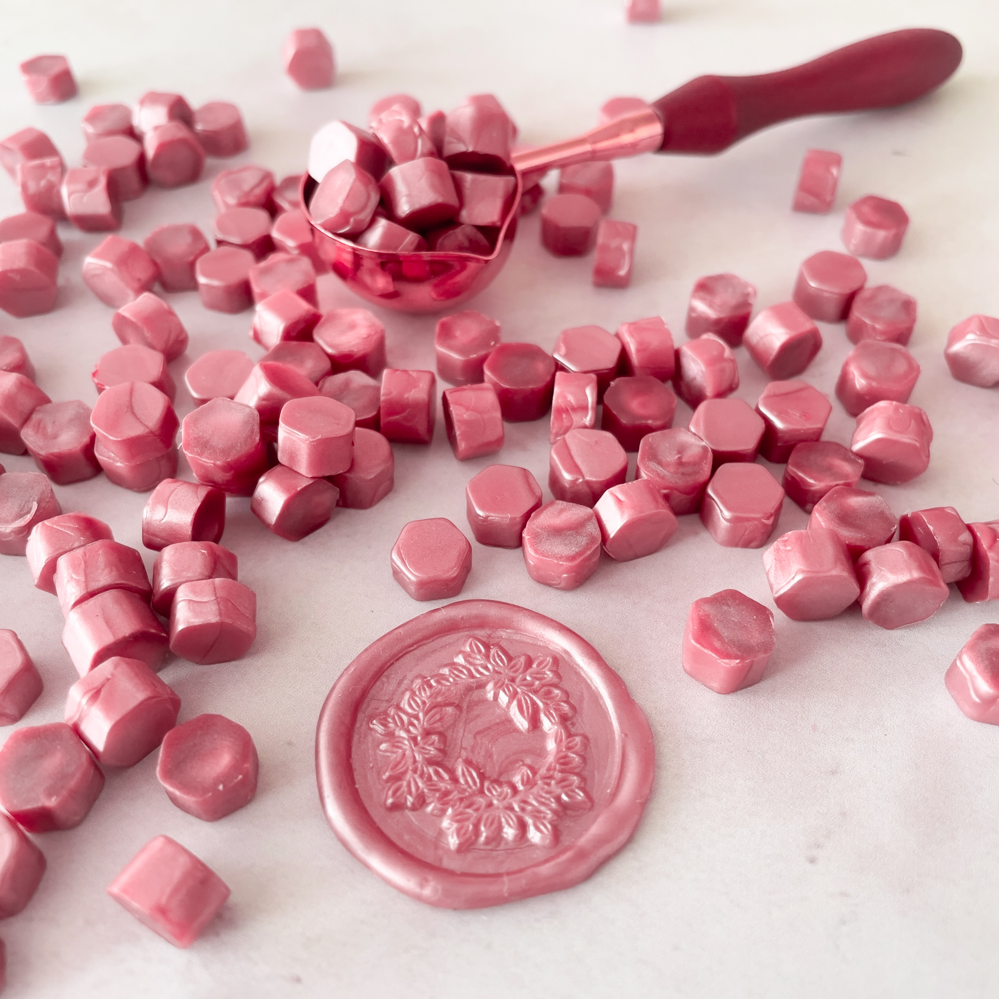 pink sealing wax.  Dusky pink sealing wax beads to make stamps and seals.  Plastic free wax