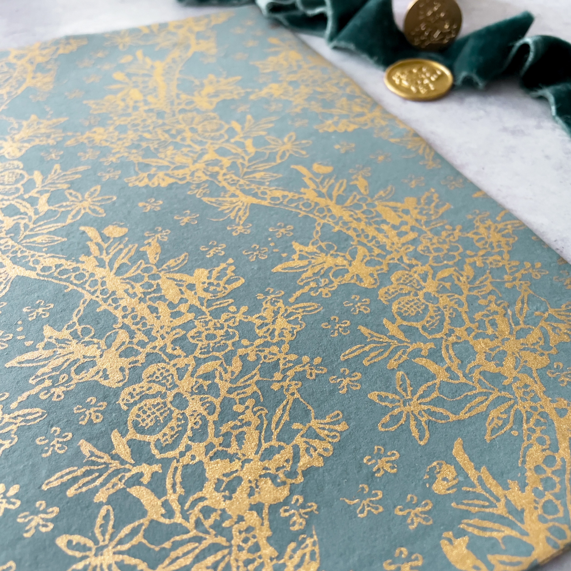 Fleur lustre paper in dark grey and gold.  Decorative paper for crafts.  By The Natural Paper Company.