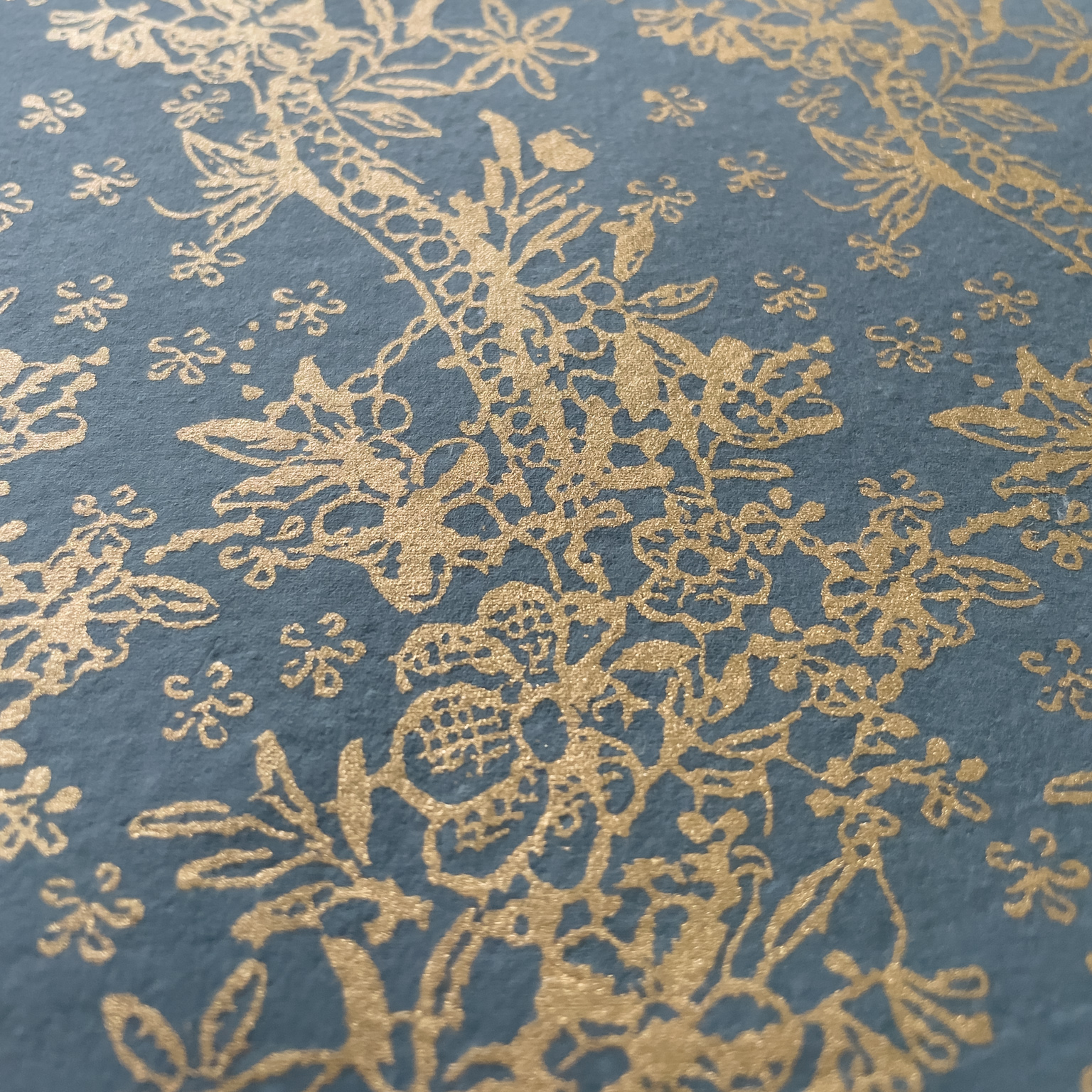 Recycled paper for crafts.  Decorative craft paper in dark grey with a metallic gold pattern.  By The Natural Paper Company.