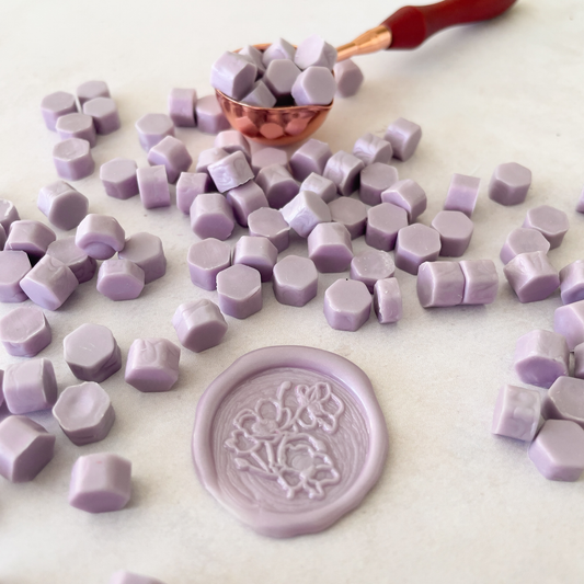 lilac sealing wax beads to make wax stamps and wax seals.