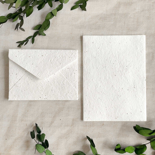 Plantable paper and envelopes with basil seeds.  Handmade cotton rag paper with seeds.  Eco friendly stationery