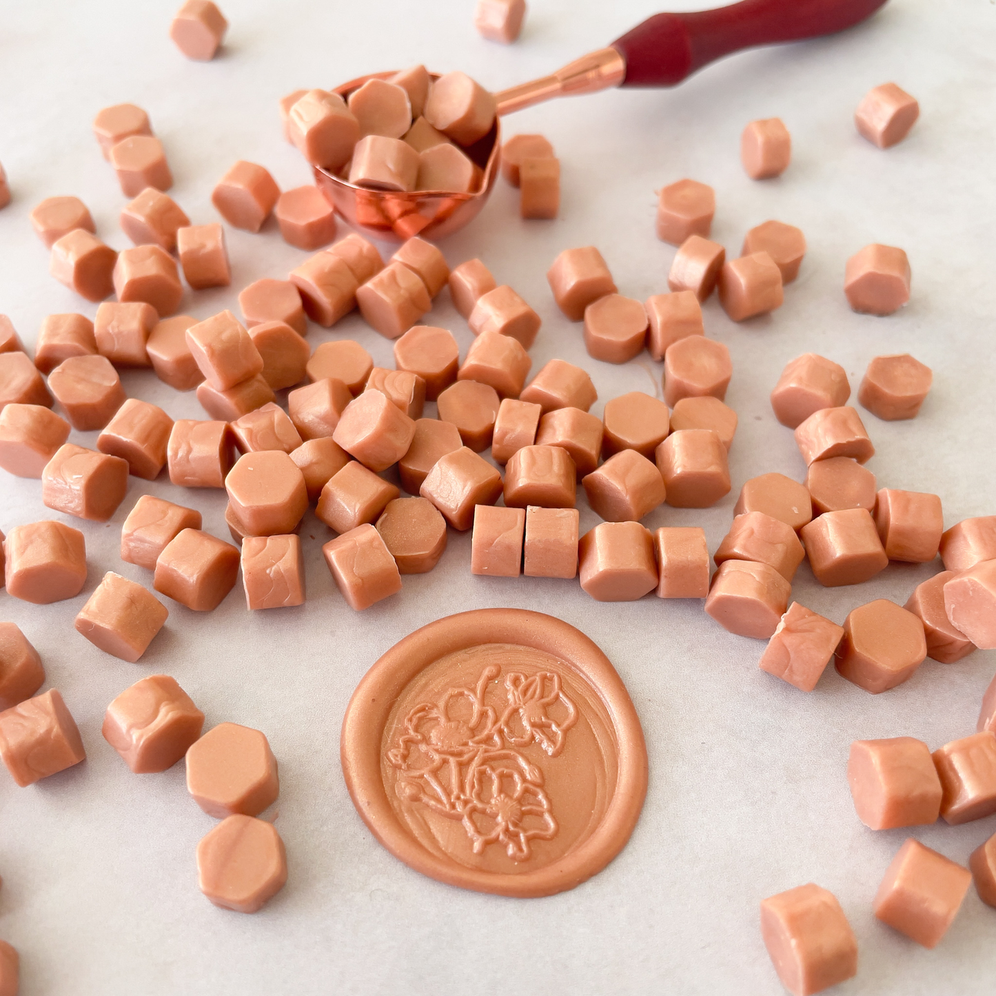 rose gold sealing wax beads.  Small beads of wax in pearlised rose gold colour.  Perfect to make envelope seals, wax seals and wax stamps in rose gold colour