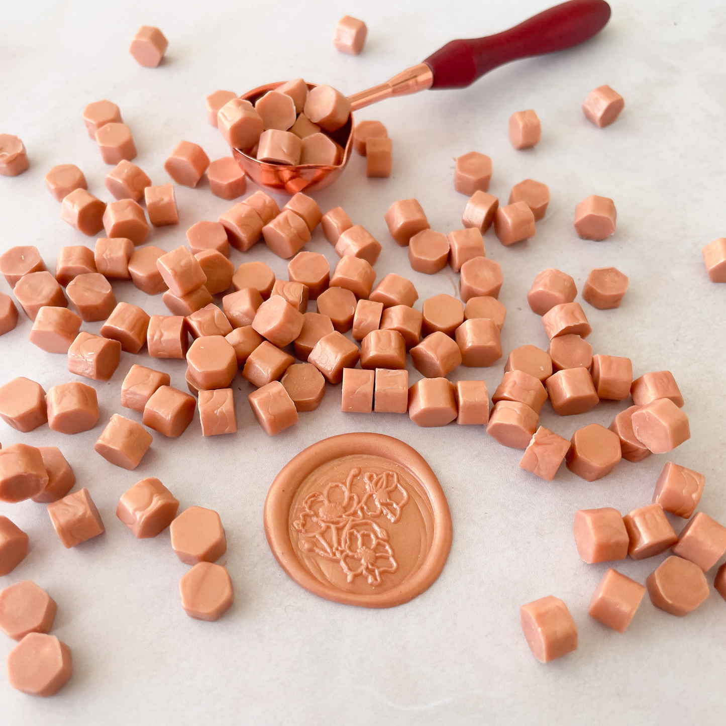 small hexagon shaped wax beads for wax seals and stamps.  Rose gold colour sealing wax