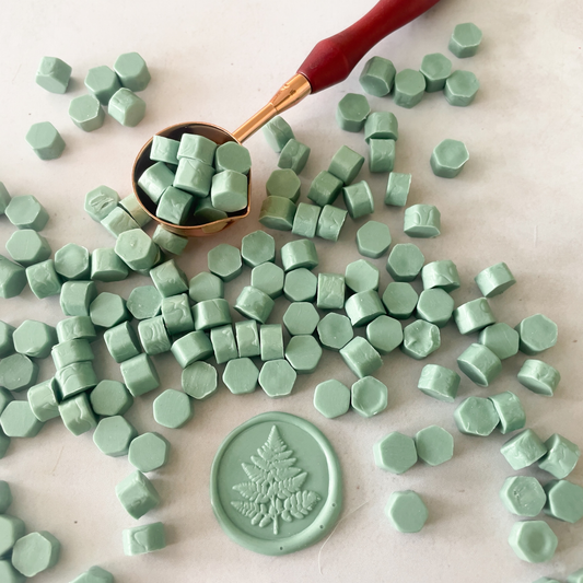 sage green sealing wax beads.  Small wax beads to make traditional wax stamps.  To use with a melting spoon.  Plastic free wax beads