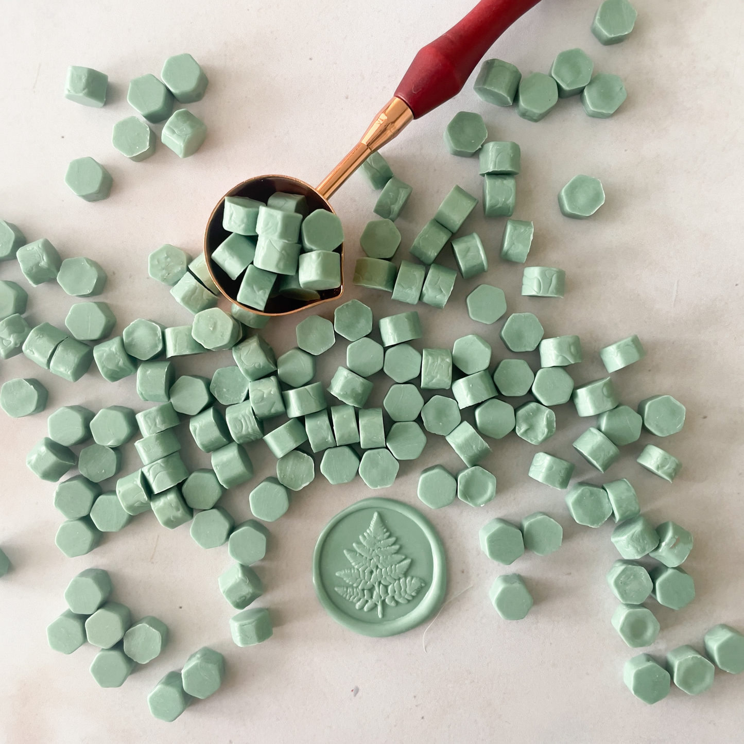 sealing wax beads in sage green.  Plastic free wax beads to make wax stamps.  Sealing wax supplies