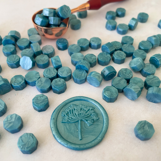 sea green colour sealing wax beads.  Small beads of wax to make stamps and seals