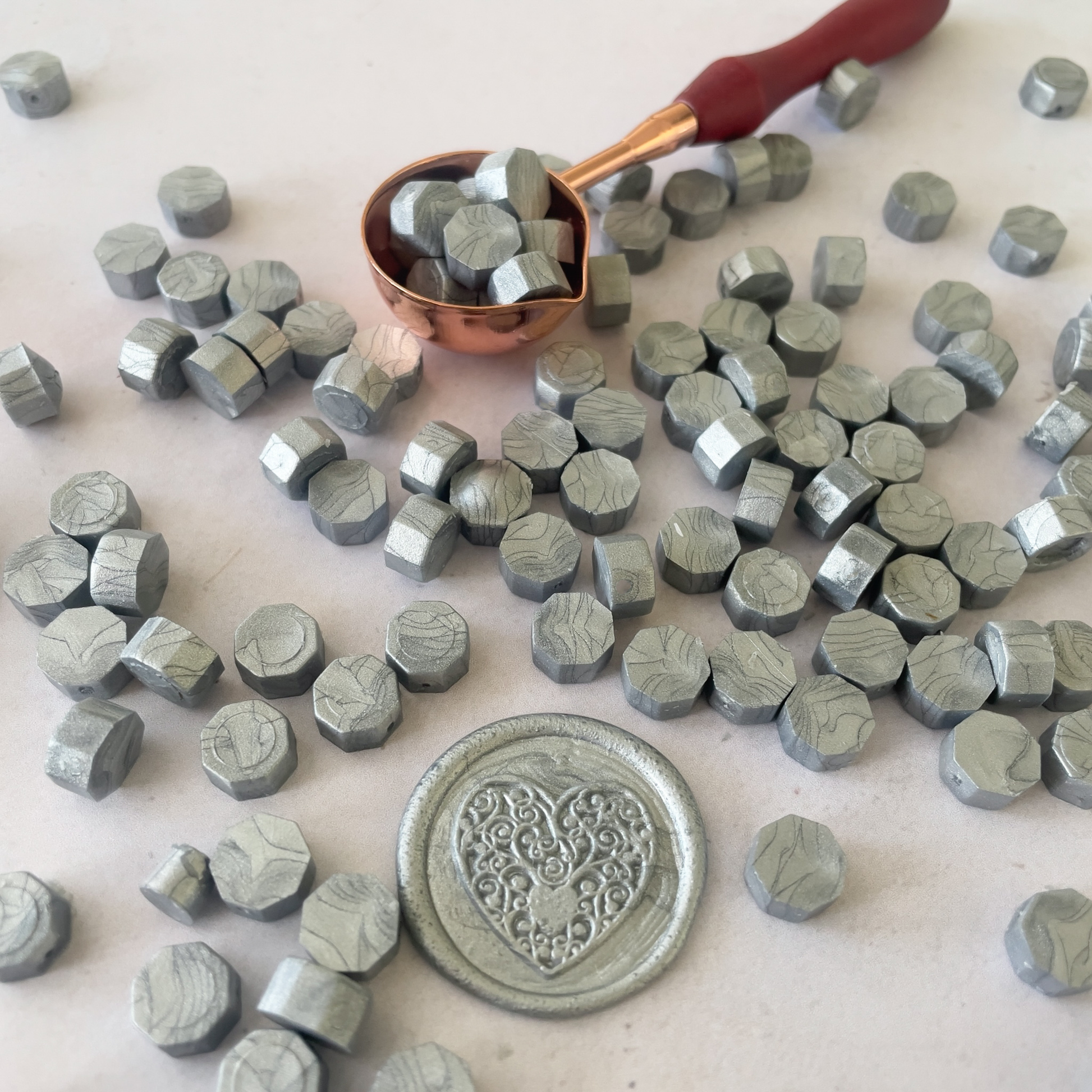 silver sealing wax beads to make wax stamps and seals.  Small hexagon shaped wax beads.  Plastic free