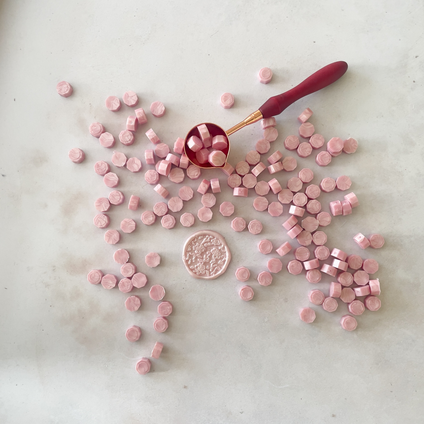sealing wax beads in pearlised pink.  Small wax beads to make wax stamps and wax seals.  Pearlised pink 