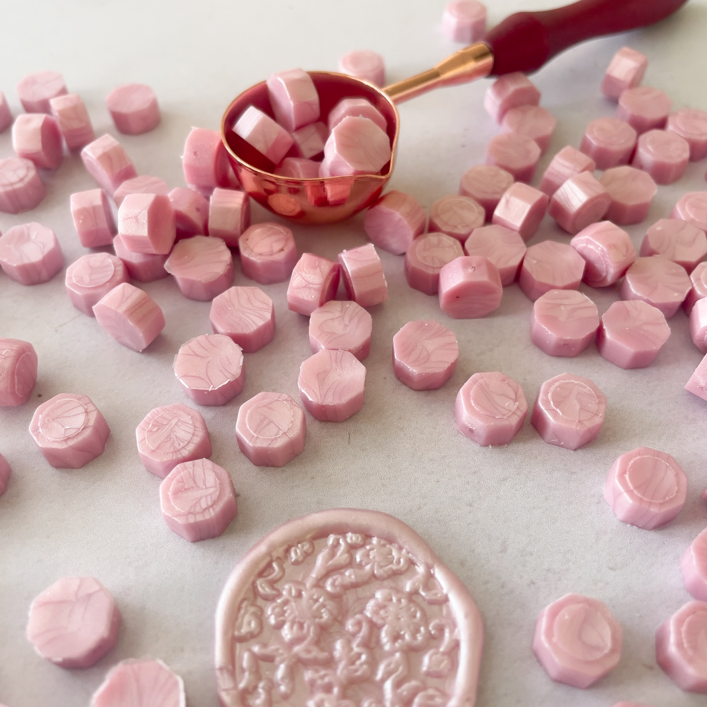 Pearlised pink sealing wax beads.  Small hexagon shape wax beads to make stamps and seals.  