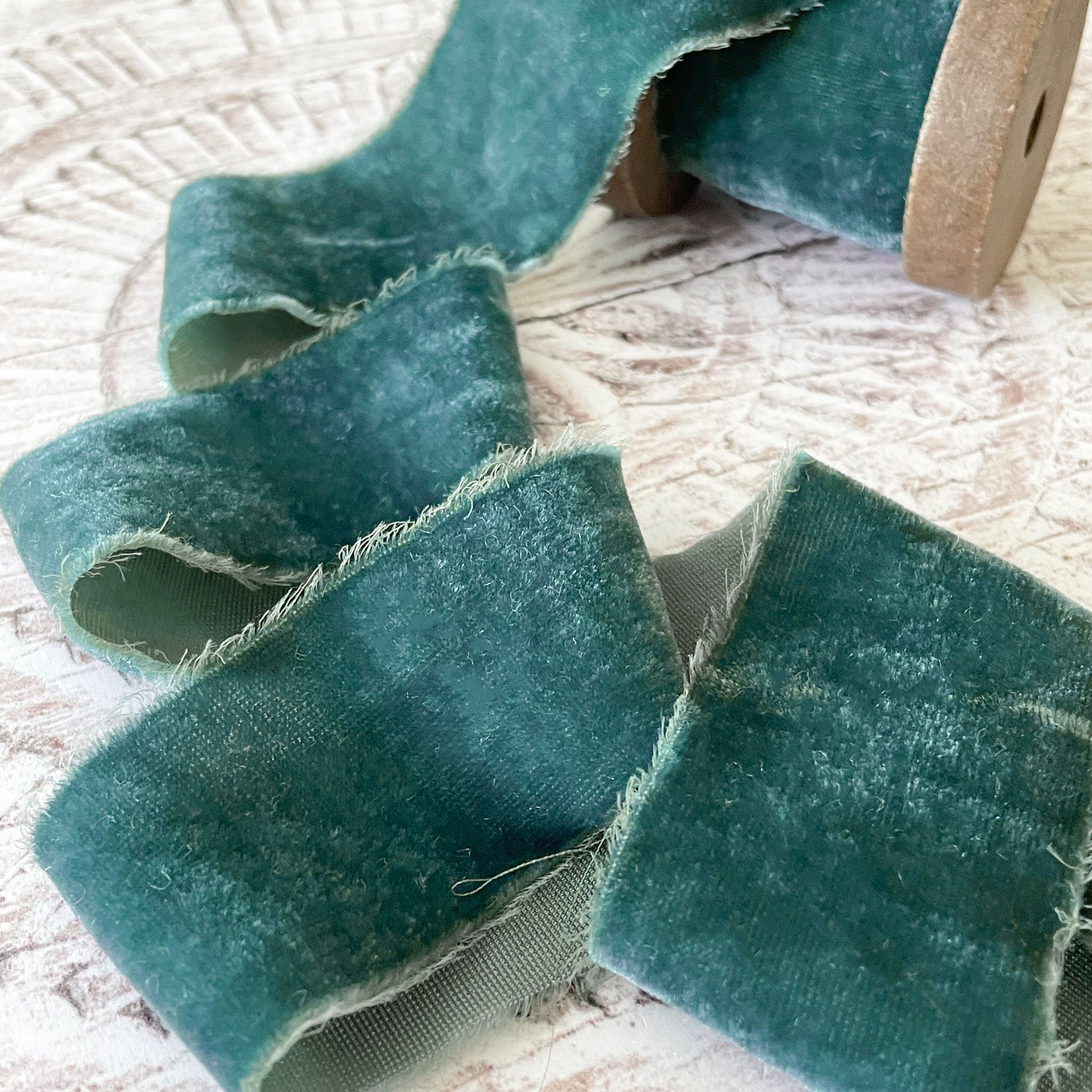 silk velvet ribbon in teal.  Luxury fine velvet ribbon in teal green colour.  Fine velvet ribbon with a torn edge