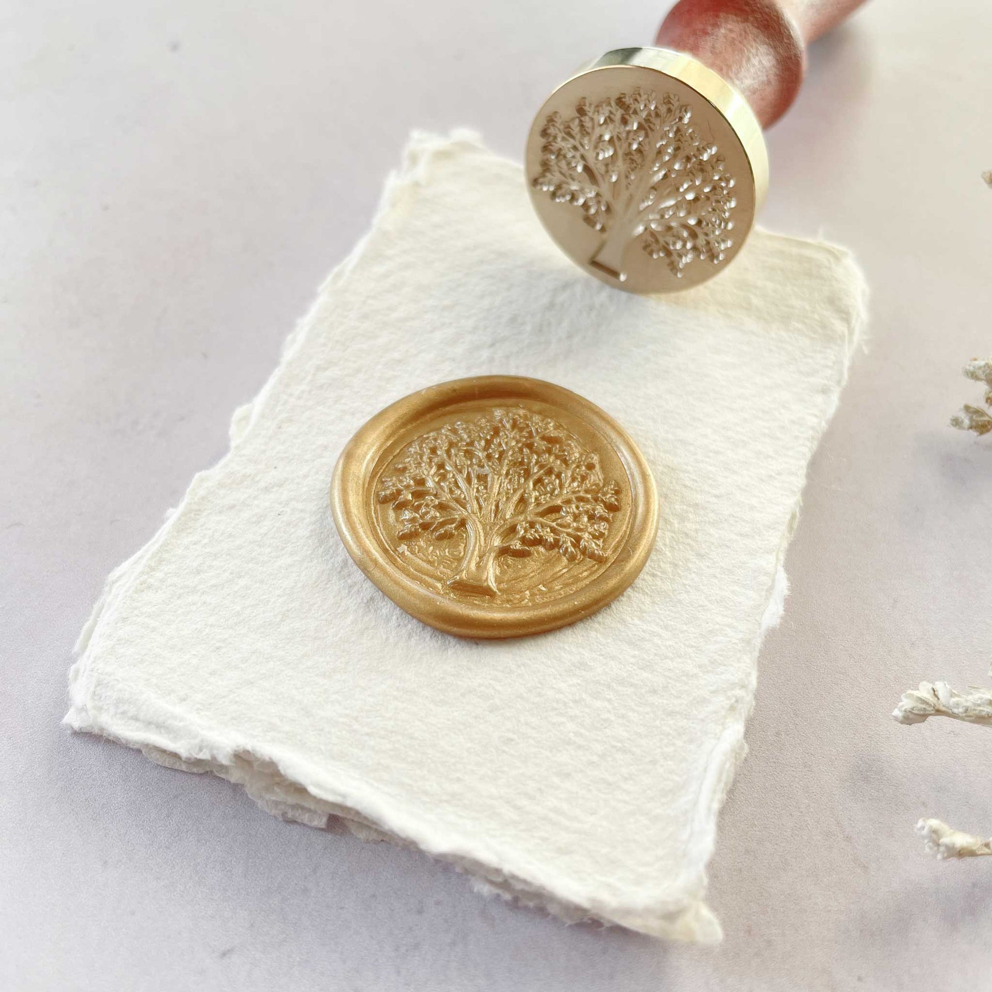 Make tree design wax seals with The Tree of Life sealing wax stamp by The Natural Paper Company.  Brass stamp with a wooden handle.