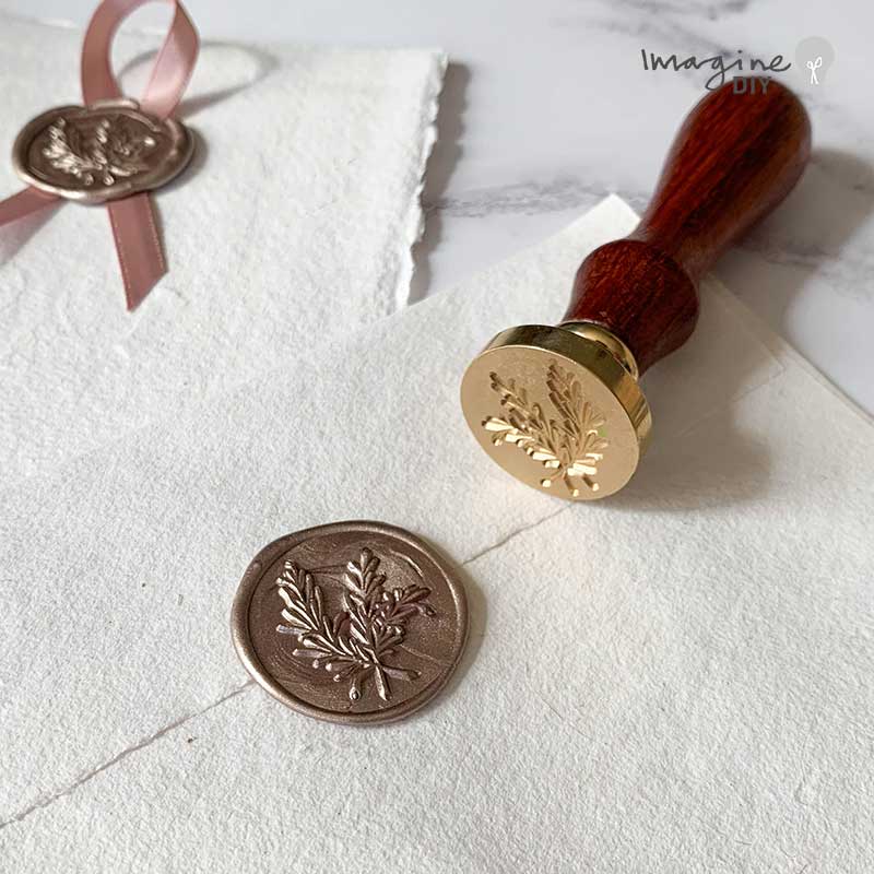 Olive brand design wax stamp for making wax seals.  Traditional sealing wax stamp with a natural floral design.  Perfect for decorating eco friendly wedding invitations, stationery, envelope, packaging and more.  By The Natural Paper Company