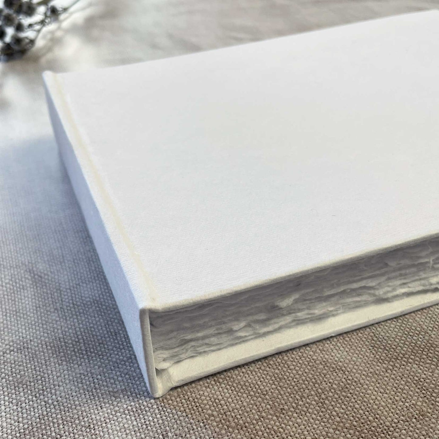 handmade white blank journal with 100 bound pages of recycled cotton rag paper
