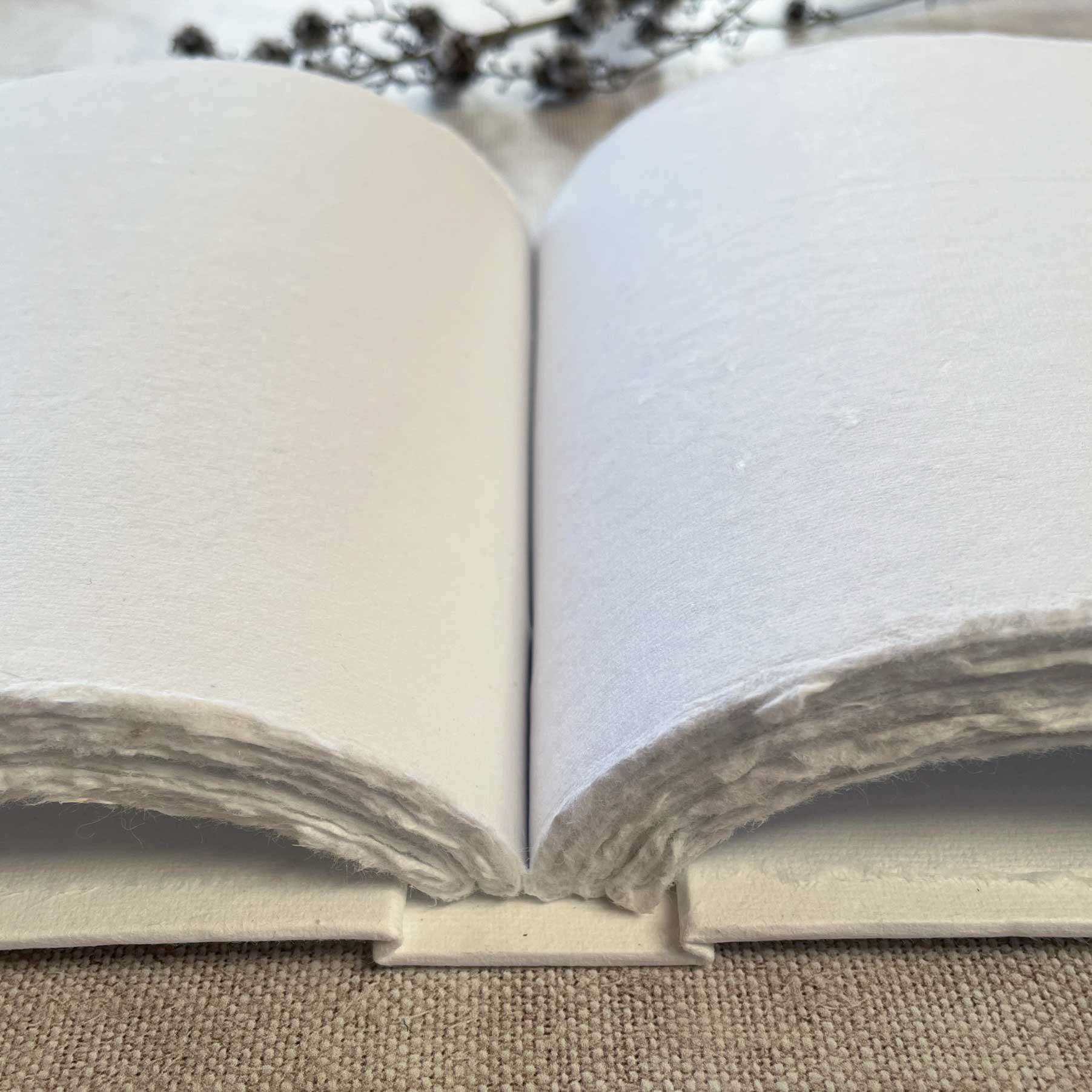 handmade recycled cotton rag paper book with blank pages and blank cover.  Hard cover blank book.  Perfect for use as a guest book, notebook, journal or artist sketch pad